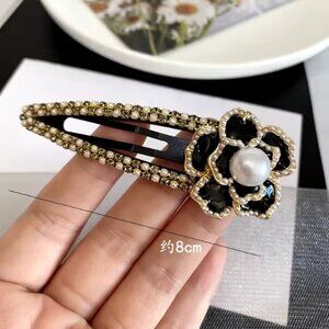 Elegant Black and Gold Camilla Flower Hair Clip with Pearl Accent